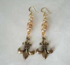 "These beautiful earrings have gold plated filigree beads, glass pearl beads, seed beads and brass fleur de lis charms. 2.5\" long from hook bottom." Medieval Earrings, Jewelry Victorian, Elven Jewelry, Victorian Earrings, New Plymouth, Pagan Jewelry, Medieval Jewelry, Southwest Jewelry, Bohemian Rings