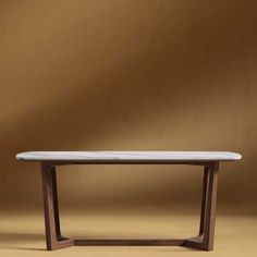 a white marble top table against a brown background