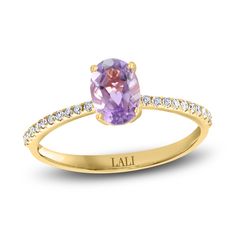 A mesmerizing oval-cut natural amethyst gemstone shimmers with elegance in the center of this gorgeous women's ring from the Lali Jewels Collection. Brilliant round diamonds line the band to complete the look. Fashioned in 14K yellow gold, the total diamond weight is 1/10 carat. Amethyst Engagement Ring, Amethyst Ring Engagement, Diamond Stacks, Jared The Galleria Of Jewelry, Elegant Pendant, Gemstone Engagement Rings, Amethyst Stone, Amethyst Gemstone, Diamond Stone