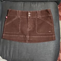 Mini Skirt Casual Brown Mini Skort, Casual Brown Mini Length Skort, Trendy Brown Cotton Skirt, Brown Mini Skort With Pockets, Y2k Brown Skirt For Spring, Y2k Style Brown Skirt For Spring, Brown Y2k Skirt For Spring, Fitted Mini Skirt Casual Style, Brown Cotton Mini Skirt With Pockets