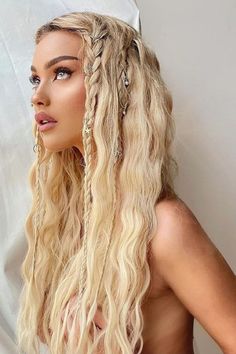 a woman with long blonde hair and braids