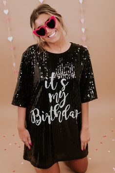 Party like it's your birthday! The It's My Birthday Sequin Dress features a round neckline, a stunning sequin design, a full lining, and the text " It's My Birthday" across the front in white. The ideal dress to accessorize and wear out on your big day! Short sleeves Round Neckline Above the knee hemline Sequin Pattern both front and back Full lining - not itchy at all Fit: oversized Fabric: 65% Polyester, 30% Cotton, 5% Spandex Imported Model Specs: Emily is wearing a size small in the photo.Ho Birthday Sequin Dress, Sequin Dress Black, Sequin Pattern, It's My Birthday, Sequin Design, Vip Group, Everyday Chic, Black Sequin Dress, Bride Tribe