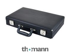 a black suitcase sitting on top of a white floor next to the words thomann