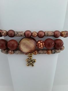 This handmade glass pearl fashionable stretch stackable bracelet set is explicitly designed for women with small-size wrists.  Fits wrist sizes approx 6 3/4 inches to 7 inches  A beautiful 3- piece handmade stretch glass bead stack bracelet set was created with gorgeous glass beads, acrylic beads, and brownstone beads with gold flecks in breathtaking shades of brown that sparkle, glisten, and shine.  Wear this bracelet set to dress up any outfit, you can wear the bracelets stacked or separately, either way, these are standout and speak volumes of beauty. These beautiful stretch bracelets are all handmade with integrity and the best quality materials for that high-end look and appeal for an affordable price.  Beauty does not have to be expensive. Your bracelet arrives in a Jewelry box with Unique Gift Card Holder, Bracelets Stacked, Handmade Beaded Bracelets, Stack Bracelet, Gift Sets For Her, Oil Diffuser Bracelet, Essential Oil Diffuser Bracelet, Gift Sets For Women, Fancy Gifts