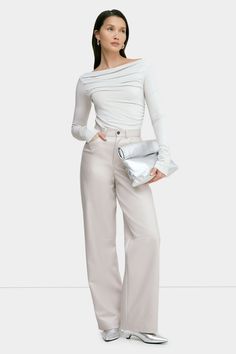 A force of nature in stretchy faux leather with a high-sheen finish, our Julien Pants offer a luxe feel to any look. Perfect for year-round wear, we've designed Julien with a wide-leg, high-rise cut and a distinctive horizontal seam at the knees. She'll elevate wherever and whenever you wear her. Also available in latte. | Yada, in bone, is 5'9" (175 cm) tall, wearing size XS. Sam, in red, is 5'8" (173 cm) tall, wearing size XS. Astrid, in red, is 5'9" (175 cm) tall, wearing size XS. Rocio, in black, is 5'9.5" (175 cm) tall, wearing size XS. Total length from below the waist is approximately 42.5" (108 cm). Inseam length is approximately 33" (84 cm).Vegan Leather (93% Polyester, 7% Spandex).Machine wash on delicate cycle, or hand wash in cold water. Lay flat to dry. Designed in NYC. Handcr Red Bone, Force Of Nature, Tunic Hoodie, A Force, Sweatshirt Fabric, Red Pants, White Pants, Pants Outfit, Skirt Pants