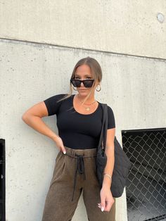 SEAMLESS WAFFLE SCOOP NECK MIDI CROPPED TEE COLOR: BLACK MODEL IS WEARING ML 92% NYLON/8% SPAN RUNS TRUE TO SIZE MODEL MEASUREMENTS: WEIGHT 150 LBS, 5’2”, SIZE 6, BUST 35”, WAIST 28”, HIPS 37”, BRA SIZE 34D Fitted Athleisure T-shirt For Fall, Fall Athleisure Tops With Short Sleeves, Sporty Workout T-shirt For Fall, Fall Athleisure T-shirt For Workout, Sporty Black T-shirt For Fall, Black Ribbed T-shirt Relaxed Fit, Athleisure Crew Neck Top For Work, Black Ribbed Relaxed Fit T-shirt, Crew Neck Athleisure Tops For Work