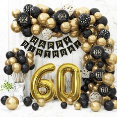 an image of a 60th birthday celebration with balloons and streamers in gold, black and white colors