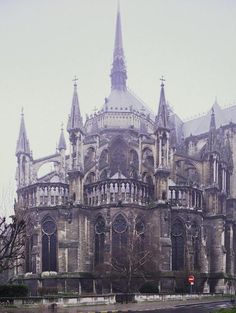 an old building with many windows and spires