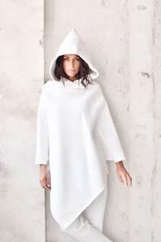 "Subscribe for Aakasha Newsletter for Special Offers and Promo Codes Paste this link below in your browser http://eepurl.com/dvUKiz Extravagant Poncho / Off White Cotton Asymmetric Hoodie Your warm Fashion Challenge You Best way to express your style ! Be Original and UNIQUE and Dare to WEAR... Different sizes available S,M,L,XL Because of the loose design the most important here are bust an sleeves size S Bust 35,5\" Biceps 12,5\" size M Bust 38\" Biceps 14\" size L Bust 41,5\" Biceps 15,5\" si Asymmetric Hoodie, Fashion Challenge, Smart Casual Style, Womens Hoodies, Womens Style, Hooded Top, Futuristic Fashion, Style Challenge, Hooded Tops