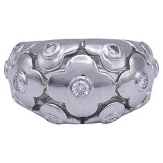 A Van Cleef & Arpels Alhambra domed ring, made of 18k white gold, featuring diamond. Diamonds are round brilliant cut, 13 stones in total, carat weight is 0.45 points. This Van Cleef Alhambra ring with a famous floral motif is one of the VCA aerie creations from Alhambra collection. The ring is stamped with VCA maker's mark, a French mark, a serial number and a hallmark for 18k gold. Alhambra is the general name for a variety of collections displaying different materials, from mother of pearl to Cleef And Arpels Jewelry, Alhambra Ring, Van Cleef Alhambra, Van Cleef And Arpels Jewelry, Platinum Diamond Rings, Gold Cufflinks, Ring White Gold, Jewelry Auction, Gold Bangle Bracelet