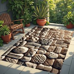 a rug made out of rocks and plants on a patio with a bench in the background