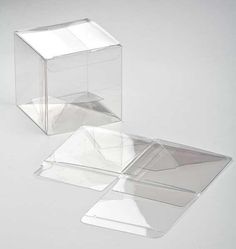 two clear boxes sitting on top of each other