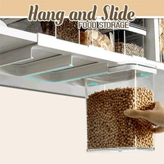 hanging and slide food storage system with two bins full of dog food, one being held up by a person's hand