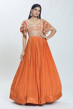 Rust brown attached cancan padded anarkali with a floral embroidered yoke and layered cutwork sleeves. - Aza Fashions Eid Anarkali Set With Cape Sleeves In Georgette, Semi-stitched Orange Dress With Intricate Embroidery, Eid Anarkali Set With Cape Sleeves, Festive Georgette Anarkali Set With Cape Sleeves, Georgette Anarkali Set With Cape Sleeves And Dupatta, Anarkali Set With Resham Embroidery And Cape Sleeves, Anarkali Gown With Zari Work And Cape Sleeves, Designer Floral Embroidered Floor-length Anarkali Set, Anarkali Dress With Dupatta And Cape Sleeves