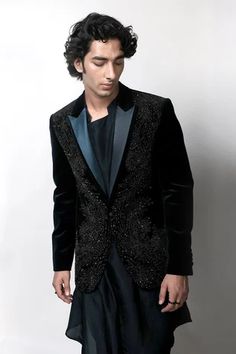 Dark teal palladian embellished tuxedo, highlighted with metallic crystals and satin detailed shawl collar.
Component: 1
Pattern: Embellished 
Type Of Work: Beads,Crystals
Neckline: Shawl Lapel Collar
Sleeve Type: Full Sleeves
Fabric: Velvet
Color: Blue
Other Details: 
Single button closure
Note: Inner kurta and trouser worn by the model is not for sale
Occasion: Party,Sangeet - Aza Fashions Rahul Khanna, Pajama Pattern, Luxury Sale, Tuxedo For Men, Tuxedo Jacket, Velvet Color, Band Collar, Fabric Silk, Jacket Pattern