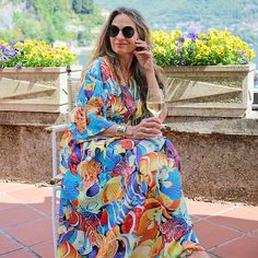 Our Mare Bello Italian silk maxi kaftan dress is the quintessential dress to wear on vacation. This colourful, whimsical marine print embodies the essence of all that is RESORT wear. Mare Bello silk is exclusively printed for Pax Philomena in Como, Italy at a world renowned fashion textile mill. YOU WILL ONLY FIND IT HERE! This dress embodies the elegance of all that is Italian. It can be worn for any occasion and is certain to get you noticed. We can guarantee one thing, you will not want to ta Resort Season Multicolor Printed Beach Dress, Vibrant Print Maxi Beach Dress, Colorful Bohemian Beach Maxi Dress, Colorful Bohemian Maxi Dress For Beach, Bohemian Colorful Maxi Dress For Beach, Colorful Printed Summer Kaftan, Colorful Bohemian Maxi Dress For The Beach, Colorful Kaftan For Vacation, Colorful Printed Maxi Dress For Beach Season