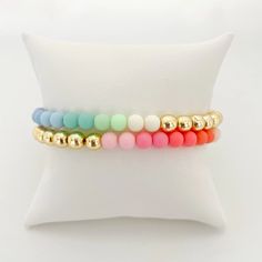 Pastels and gold? Yes, please! Our best-selling Gold Bead bracelet gets a pretty pop of color thanks to our pastel acrylic beads. Add to your stack or wear alone but either way, these bracelets will pretty up your arm party! Bracelet measures 7" in circumference. If you need a custom length, please send an email to hel Gold Bead Bracelet, Pop Collection, Gold Bead Bracelets, Arm Party, Sell Gold, Jewel Box, Acrylic Beads, Bead Bracelet, Gold Beads