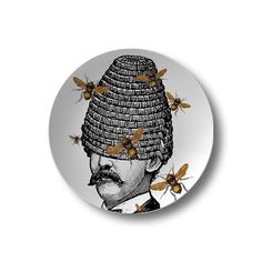 a button with bees on it and a man's head in the middle, surrounded by honeybees