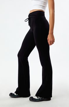 Make a stylish statement with the Low Rise Cinched Flare Pants from PacSun, featuring a unique fold-over waistband with a cinched front detail for added flair. Designed with a flattering low-rise fit and flared leg openings, they offer a trendy twist to elevate your everyday ensemble with effortless sophistication.


	9" rise
	30" inseam
	Low-rise
	Fold-over waistband
	Cinched front detail
	Flared leg openings
	Tight fit
	95% cotton, 5% spandex
	Hand wash
	Model is wearing a size small
	Model measurements: 5’10” height, 31” bust, 23.5” waist, 34.5” hips Chic Fitted Solid Sweatpants, Chic Fitted Sweatpants, Stretch Straight Leg Bottoms With Drawstring, Stretch Wide Leg Bottoms With Drawstring, Fitted Black Bottoms With Drawstring, Black Tie Waist Bottoms For Loungewear, Black Tie Waist Loungewear Bottoms, Solid Color Yoga Pants With Drawstring, Yoga Pants With Drawstring