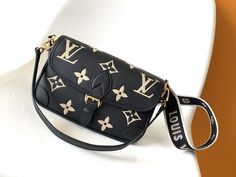 LV Diane handbag M46584 is made from two-tone embossed Monogram Empreinte leather, the brand logo is woven into the detachable wide jacquard shoulder strap, and the detachable leather shoulder strap is added with crossbody options, flexible and suitable for elegant style or sporty style, full of retro 90s style. Color: Black. Monogram Empreinte cowhide leather. Cowhide leather trim. Microfiber lining. Gold finished metallic hardware. Hook closure. Internal zipped flat pocket. ... Louis Vuitton Diane, Tom Ford Shoes, Lv Shoes, Versace Shoes, Ysl Shoes, Hermes Shoes, Balenciaga Shoes, Fendi Shoes, Valentino Shoes