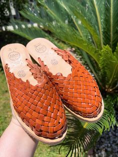 COLOR: BRICKUPPER: LEATHERSOLE: CREPE Handmade huaraches from Michoacán, Mexico. Made with 100% leather. SIZING *Please refer to sizing chart*If you wear a half-size shoe we recommend sizing down (ex: Your shoe size is 7.5, size down to size 7)If you have a wide foot, For example, your shoe size is 7.5 then size up for a more comfortable fit. Leather stretches and will mold after a few uses*Please advise since all of our huaraches are handmade with genuine leather minor wrinkles and markings mig Spring Brown Woven Leather Huaraches, Brown Woven Leather Huarache Sandals, Casual Vegetable-tanned Leather Sandals, Casual Adjustable Brown Mules, Casual Adjustable Closed Toe Mules, Flat Woven Leather Huarache Sandals, Brown Flat Huarache Sandals With Leather Sole, Casual Woven Leather Clogs, Adjustable Woven Leather Huaraches