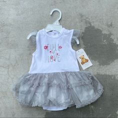 Nwt Ren Rof Baby Full Of Love Dress Onesie Label Tag: 6/9 Months Description: Nwt. Hanger Included. P.S **Refer To Pictures For Item Condition As Well As Reading Item Description Thoroughly. Anything I May Have Missed Are Included As Part Of The Listing. Dm For Inquiries Playful White Tutu Dress With Ruffles, Spring White Cotton Tutu Dress, White Short Sleeve Tutu Dress For Summer, White Cotton Tutu Dress For Spring, White Short Sleeve Summer Tutu Dress, Summer White Short Sleeve Tutu Dress, Cute Fitted Cotton Tutu Dress, Playful White Sleeveless Tutu Dress, Playful Sleeveless White Tutu Dress