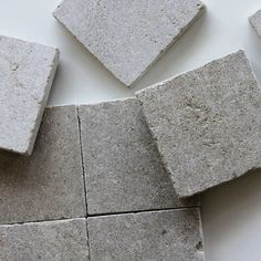 several pieces of cement laid on top of each other in the shape of cubes