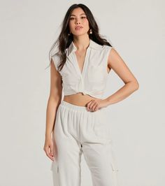 This breezy linen crop top is a sunny day staple! Designed with a lightweight linen-blend fabric, this top is perfect for your summer weekend plans. It features a collared V-neckline with a partial button-down front, a single chest pocket, cap sleeves, a twist-front cropped hem, and a relaxed fit. Style with wide-leg pants and sandals.Fit & FeaturesLinen-blend fabricCollared V-necklineChest pocket, button-down frontCap sleevesSide zipper closureTwist-front cropped hemRelaxed fitRuns true to Linen Crop Top For Summer Vacation, Linen Cropped Top For Day Out, Chic White Cropped Shirt For Summer, Casual Linen Crop Top For Vacation, Casual Linen Crop Top For Day Out, White Linen Beach Crop Top, White Linen Crop Top For Summer, White Linen Crop Top For Beach, Casual Rayon Crop Top For Summer