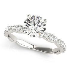 a white gold engagement ring with diamonds on it