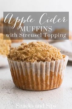 a muffin with crumbs in it sitting on top of a table