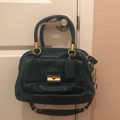 Authentic Coach Handbag. Double Zipper, In Great Used Condition. Color Is A Deep Teal. Matching Wallet Blue Coach Double Handle Bags, Blue Coach Handbag With Top Carry Handle, Blue Coach Shoulder Bag With Detachable Handle, Elegant Blue Coach Wallet, Blue Coach Bag With Zipper Closure, Coach Leather Bag, Coach Satchel, Grey Shoulder Bag, Tan Handbags