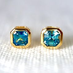 Teal Blue Sapphire Bezel Stud Earrings in 14kt Yellow Gold Green Sapphire Stud Earrings Push Back Earrings Green Sapphire Minimal Studs - Etsy Blue High Luster Earrings For Formal Occasions, Formal Blue High Luster Earrings, Blue Bezel Set Earrings For Formal Occasions, Blue Bezel Set Earrings For Gift, Anniversary Yellow Gold Earrings With Blue Topaz, Anniversary Yellow Gold Blue Topaz Earrings, High Luster Blue Jewelry For Anniversary, Blue Gemstone Earrings In 14k Gold, Blue Sapphire Earrings