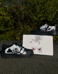 -MADE TO ORDER- AIR FORCE 1's CUSTOM  Hey there! I'm an artist making custom anime shoes! I can draw any characters you like on a pair, one on each shoe, all in black and white. These shoes are perfect for anime and sneaker fans. Each order comes with a customised box and is packed carefully to avoid damage. ~Made to order :  -tell me your shoe size  -characters you want on the shoe  - If you have any questions, just drop me a message Shipping info: - Expect your order in about 14 days - I'll ke Black Casual Custom Sneakers With Anime Print, Black High-top Sneakers With Anime Print, Black Anime Print Sneakers With Round Toe, Black Sneakers With Anime Print And Round Toe, Harajuku Black Sneakers With Rubber Sole, Customizable Black Sneakers With Round Toe, Black Low-top Harajuku Skate Shoes, Black Harajuku Low-top Skate Shoes, Custom Black Sneakers With Rubber Sole