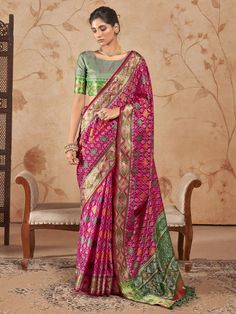 Elevate your ethnic wardrobe with our mesmerizing rani pink zari weaving patola silk traditional saree. Crafted with intricate zari weaving work, this saree exudes elegance and charm, making it perfect for festivals, events, and any special occasion. The vibrant rani pink color adds a pop of color to your ensemble, while the silk fabric drapes beautifully, enhancing your traditional look effortlessly.
The saree comes with a matching green color silk blouse that also features zari weaving work, c Blouses Work Designs, Patola Saree Blouses Work, Green Patola Saree, Patola Silk Saree, Lehenga Crop Top, Saree Tassels, Rani Pink, Lehenga Choli Wedding, Floral Lehenga