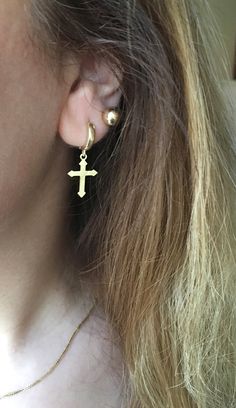 14k gold dangling cross earring ♡ unisex. looks super cool both on men and women shipping: ♡ all listings include free expedited shipping delivers in 2-4 business days care tips : we want you to wear your jewelry for a long long time happily so, to maintain the quality of your new jewelry, please: ♡ do not wear it to the pool, spa, or the beach ♡ remove when sleeping, exercising, or doing other physically strenuous activities ♡ avoid contact with perfumes, body oils, and other chemicals, includi Minimalist Gold Cross Earrings, Gold Cross Pendant Earrings As Gift, Gold Cross Pendant Earrings For Gift, Gold Hypoallergenic Cross Earrings, Yellow Gold Cross Earrings For Pierced Ears, Gold Cross Hypoallergenic Earrings, 14k Gold Cross Earrings, Gold Cross-shaped Pierced Earrings, Mens Gold Signet Rings