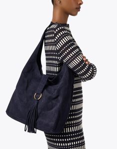 This navy bag from Laggo is the perfect everyday carryall. Large enough to carry all of your essentials, it's suede composition for durability and style. Wear it with a pair of jeans and a light top for a warm day. Daily Use Suede Shoulder Bag With Top Carry Handle, Suede Shoulder Bag With Handle Drop For Daily Use, Modern Suede Bag For Daily Use, Modern Suede Satchel For Daily Use, Modern Suede Tote Hobo Bag, Versatile Suede Hobo Bag For Daily Use, Suede Bag With Top Carry Handle For Daily Use, Suede Shoulder Bag With Top Carry Handle For Travel, Modern Suede Hobo Bag With Double Handle