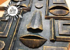 a close up of a metal object on a table with the words the art teacher above it