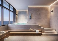 a bath room with a large window and a jacuzzi tub next to it