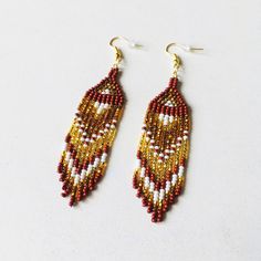 Here are bright beaded earrings with fringe. Inspired by tribal style, these seed bead earrings have a shining gradient pattern that will sparkle with every move. This pair should be in your summer jewelry collection if you love bohemian or ethnic accessories. These statement waterfall earrings will be a great addition to any evening outfit. 100% top quality handmade earrings.  Length: 3.94'' / 10 cm  Width: 0.83'' / 2,1 cm Materials:  - Czech seed beads - gold-toned stainless steel accessories. The real color of the item may be slightly different from the picture shown on website caused by the brightness of your monitor. If you have special size requirements, please send me a letter about it, as this can be made to order. More beadwork earrings: https://etsy.me/30peGhg Back to shop: https Waterfall Earrings, Gradient Pattern, Earrings Patterns, Steel Accessories, Evening Outfit, Earrings Summer, Stainless Steel Accessories, Evening Outfits, Seed Bead Earrings