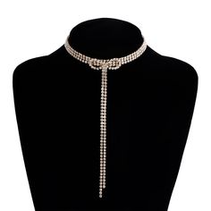 ✦ Make a dazzling entrance with our Exquisite Sparkly Rhinestones Ribbon Choker. This necklace is designed to turn heads and elevate your look. The rhinestones are intricately arranged in a ribbon pattern, reflecting light and creating a sparkling effect. The adjustable ribbon closure ensures a perfect fit, and the tassel detail adds a touch of movement and charm. Whether worn for a special occasion or to add a touch of glamour to your everyday style, this sparkly choker necklace is a must-have Elegant Alloy Necklaces For Evening, Party Jeweled Alloy Jewelry, Adjustable Rhinestone Necklaces For Evening, Adjustable Rhinestone Evening Necklace, Glamorous Alloy Jewelry For Party, Party Alloy Jewelry With Bling, Glamorous Alloy Party Jewelry, Glamorous Rhinestone Alloy Jewelry, Adjustable Metal Rhinestone Choker