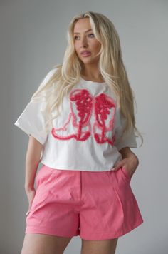 Experience the perfect blend of comfort and Western style with our Cowboy Boots Embroidered Tee. Featuring short sleeves, a round neck, and an oversized fit, this tee is adorned with multicolor yarn cowboy boots embroidery for a unique, eye-catching look. Embrace your inner cowboy and elevate your wardrobe with this statement piece. relaxed oversized fit pink yarn cowboy boots embroidered 100% cotton hand wash cold model is wearing a small Cowboy Boots Graphic, Curvy Date Night Outfit, Boots Embroidered, Style Cowboy Boots, Air Clothes, Multicolor Yarn, Valentines Day Dresses, Embroidered Tee, Cowboy Style