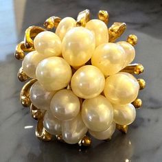 VINTAGE GORGEOUS 14K YELLOW GOLD PEARL CLUSTER STATEMENT RING     9.5 GRAMS     REALLY STUNNING!     Ring features 18 multi sized pearls set in  heavy solid 14K yellow gold setting!     Size 5.75     Ring face measures approximately 1" x 3/4" Please message me with any questions  Shipped insured in a gift box! I guarantee item to be exactly as described and pictured. Vintage Yellow Gold Cluster Jewelry, Vintage 14k Gold Pearl Ring, Vintage Gold Hallmarked Pearl Ring, Vintage Yellow Gold Rings For Evening, Vintage White Pearl Ring, Vintage Yellow Gold Pearl Ring For Formal Occasions, Gold Cluster Pearl Ring For Formal Occasions, Gold Costume Jewelry Ring For Anniversary, Black Opal Pendant