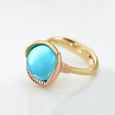 Luxury Turquoise Diamond Ring, Luxury Turquoise 14k Gold Ring, Elegant Turquoise Cabochon Diamond Ring, Elegant Turquoise Ring With Diamond Accents, Fine Jewelry Turquoise Ring With Diamond Accents, Elegant Turquoise Ring With Diamond Accents As Gift, Elegant Gold Turquoise Ring With Bezel Setting, Elegant Turquoise Diamond Ring, Elegant Turquoise Ring With Polished Finish