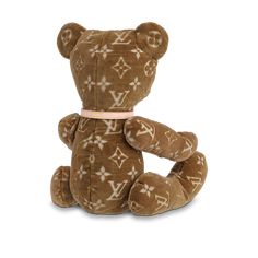 a brown teddy bear with white crosses on it