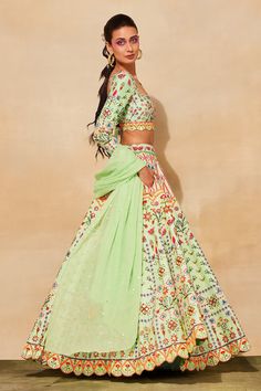 Mint green lehenga with geometric prints, cutdana, mirror embroidery and comes with separate cancan. Paired with embroidered blouse and dupatta.
Components: 4
Pattern: Printed, Embroidered
Type Of Work: Geometric
Neckline: Square
Sleeve Type: Full
Fabric: Raw silk, Lining: Shantoon, mul
Color: Green
Other Details: 
Scallope detailing
Note: The mint green lehenga set shown in the image is only being sold
Occasion: Wedding - Aza Fashions Festive Green Embroidered Lehenga, Semi-stitched Green Choli For Navratri, Unstitched Bollywood Green Lehenga, Unstitched Bollywood Lehenga In Green, Green Embroidered Bollywood Lehenga, Green Semi-stitched Lehenga For Festivals, Semi-stitched Green Lehenga For Festivals, Semi-stitched Embroidered Green Lehenga, Designer Green Embroidered Lehenga