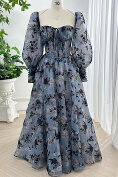 Indulge in luxury with our Corset Steal Blue Floral Print Organza Dress. The exquisite floral print and removable puff sleeves add a touch of glamour to this sophisticated piece. Made with high-quality organza, this dress will give you a flattering silhouette while making a statement at any event. Bust and Skirt with full lining. 100% Polyester 100% Recycled polyester lining Concealed zip at centre back Imported Floral Floor, Floral Dress Outfits, Floral Gown, Organza Dress, Muslimah Fashion Outfits, Floral Tea, Blue Floral Print, Modest Fashion Outfits, Designer Gowns