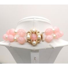 This is part of Chairish’s Costume Jewelry assortment.  1960s 2 strand goldtone pink faceted beads with smaller faux-pearl spacers necklace with box clasp. Marked "Napier" with "Pat. Pend" on the back of the clasp. Clasp: 1 1/4 inches long by 1 1/8 inches wide. The interior circumference is about 15 inches. Overall measures about 5 3/4 inches by 6 inches. Condition: Very good; some minor wear to beads and faux-pearls, nothing real noticeable. Vintage Pink Single Strand Jewelry, Pink Faceted Beads Jewelry For Formal Occasions, Pink Formal Jewelry With Faceted Beads, Vintage Pink Faceted Bead Jewelry, Vintage Multi-strand Pearl Jewelry, Vintage Pink Pearl Necklaces, Vintage Pink Pearl Necklace, Vintage Pearl Jewelry With Lobster Clasp, Box Clasp