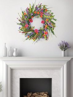 a fireplace with a wreath on top of it