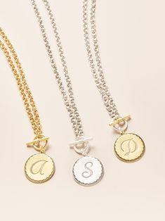 A bolder way to wear your initial~ The Front toggle closure and hand-antiqued double cable chain add an artisan vibe to a classic piece. The initial coins are hand-pressed in a New England jewelry factory that has been making them since the original heyday of sororities in the 1950’s, hence the name. John rediscovered them over ten years ago, and they have since become our signature design, featured on Oprah’s O List and worn by thousands of fans nation-wide. Product Details: Gold and Silver pla Personalized Vintage Jewelry For Everyday, Everyday Personalized Vintage Jewelry, Medallion Toggle Necklace With Coin Pendant As Gift, Silver Toggle Necklace With Coin Pendant As Gift, Vintage Initial Pendant Jewelry With Chain, Engraved Initial Coin Necklace, Timeless Engraved Coin Necklace As Gift, Medallion Jewelry With Toggle Clasp As Gift, Timeless Engraved Coin Necklace Gift