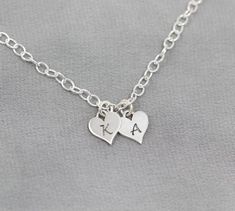 This sweet bracelet, featuring your initials engraved on Sterling Silver hearts, is sure to make her smile. Show her your love by personalizing this Sterling Silver bracelet as a thoughtful gift for a birthday, anniversary or Christmas. The Sterling Silver chain can be cut to your preferred length (standard is 7 1/2") and features an adjustable clasp so that she can adjust it to fit.TO ORDER -- Please select the initials that you would like from the drop down menus. Please include the length tha Personalized Heart Charm Bracelet For Friendship, Personalized Sterling Silver Heart Friendship Bracelet, Personalized Heart Name Bracelet For Best Friend, Personalized Heart Charm Bracelet, Personalized Heart-shaped Charm Bracelet, Personalized Name Bracelet For Best Friend Valentine's Gift, Personalized Heart Bracelet For Friendship, Heart-shaped Name Bracelet With Heart Charm For Personalized Gift, Engraved Heart Bracelet For Friendship